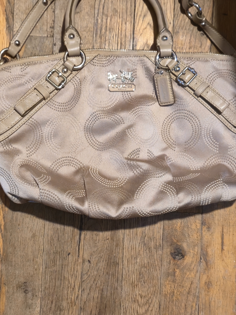 Coach Madison Dotted Op Art Sophia Satchel in a beige/tan color.
